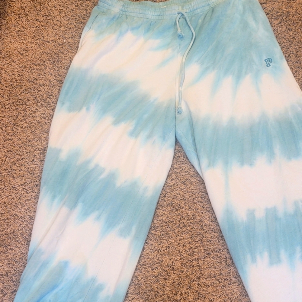 Women's pink brand bralette and wide legged lounge wear.